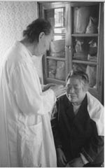 Master Duan treating patient with Qigong