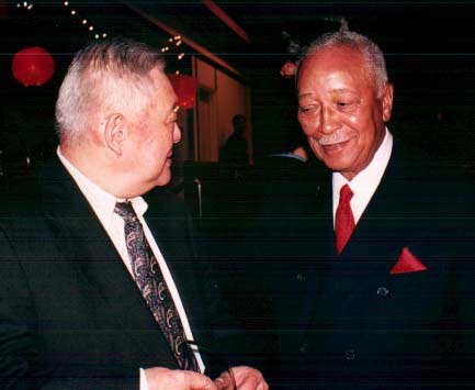 Honoree Ming Cho Lee is congratulated by former NYC mayor David Dinkins
